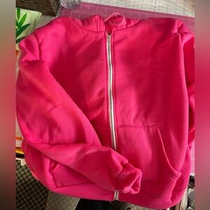 Bright pink sweatshirt run small says it to 2X it’s more like an extra large